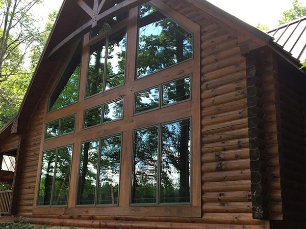 residential windows at a log cabin